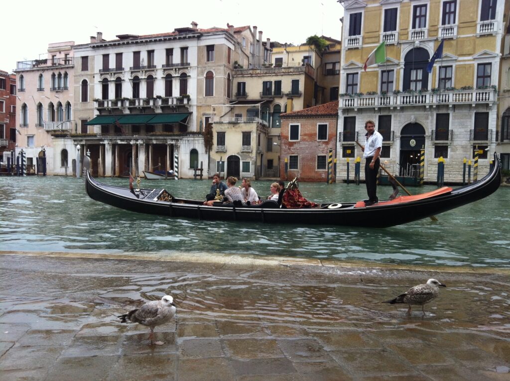 Gondola on a Venetian canal with historic buildings in Venice, Italy